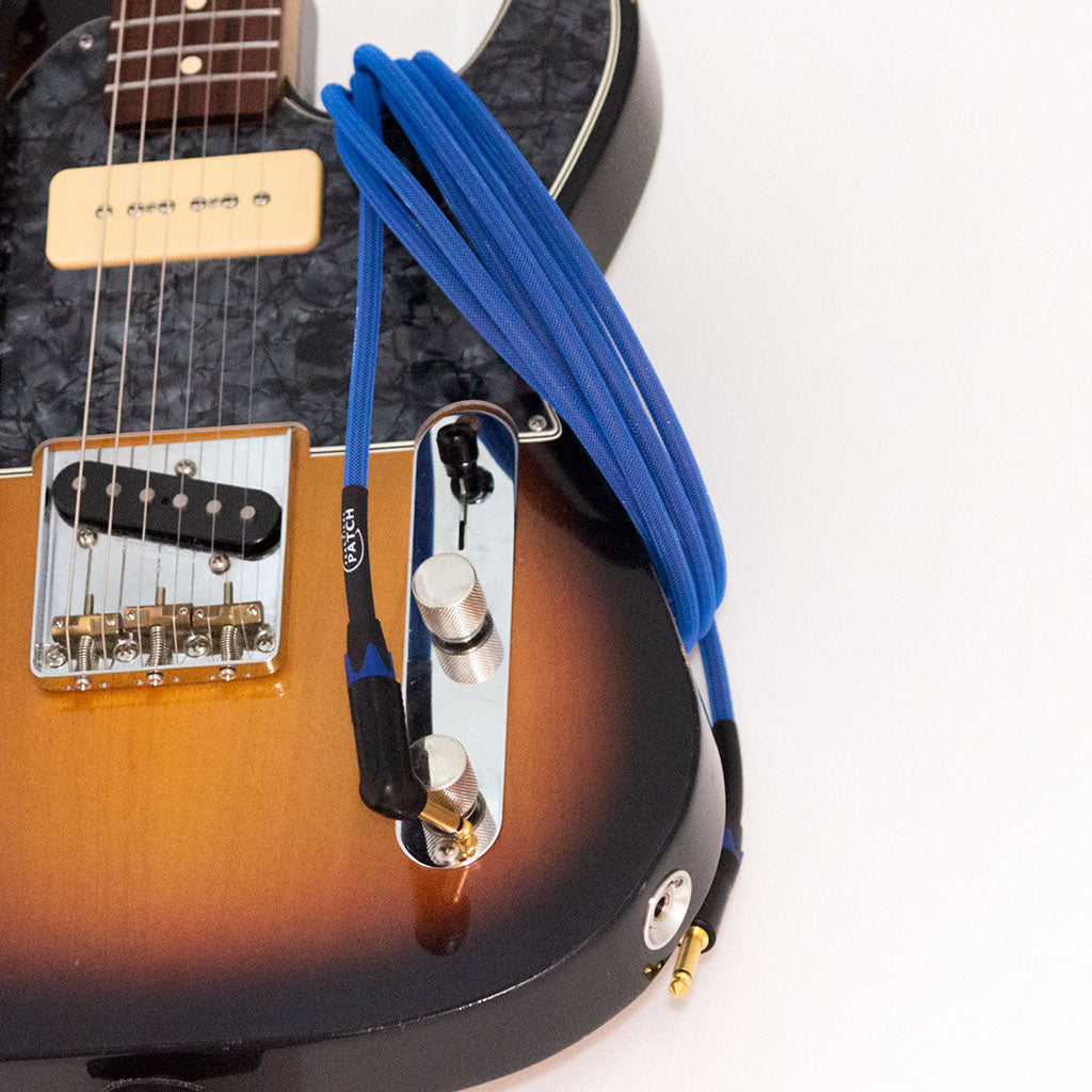 PRACTICAL PATCH Instrument Cable 15ft (4.5m) - Arisaig Blue With Guitar 1024x1024 | Boost Guitar Pedals