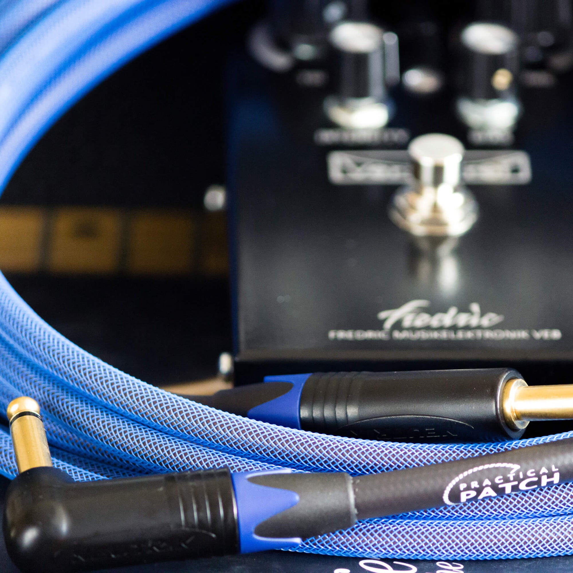 PRACTICAL PATCH Instrument Cable 15ft (4.5m) - Arisaig Blue With Guitar 1024x1024 | Boost Guitar Pedals